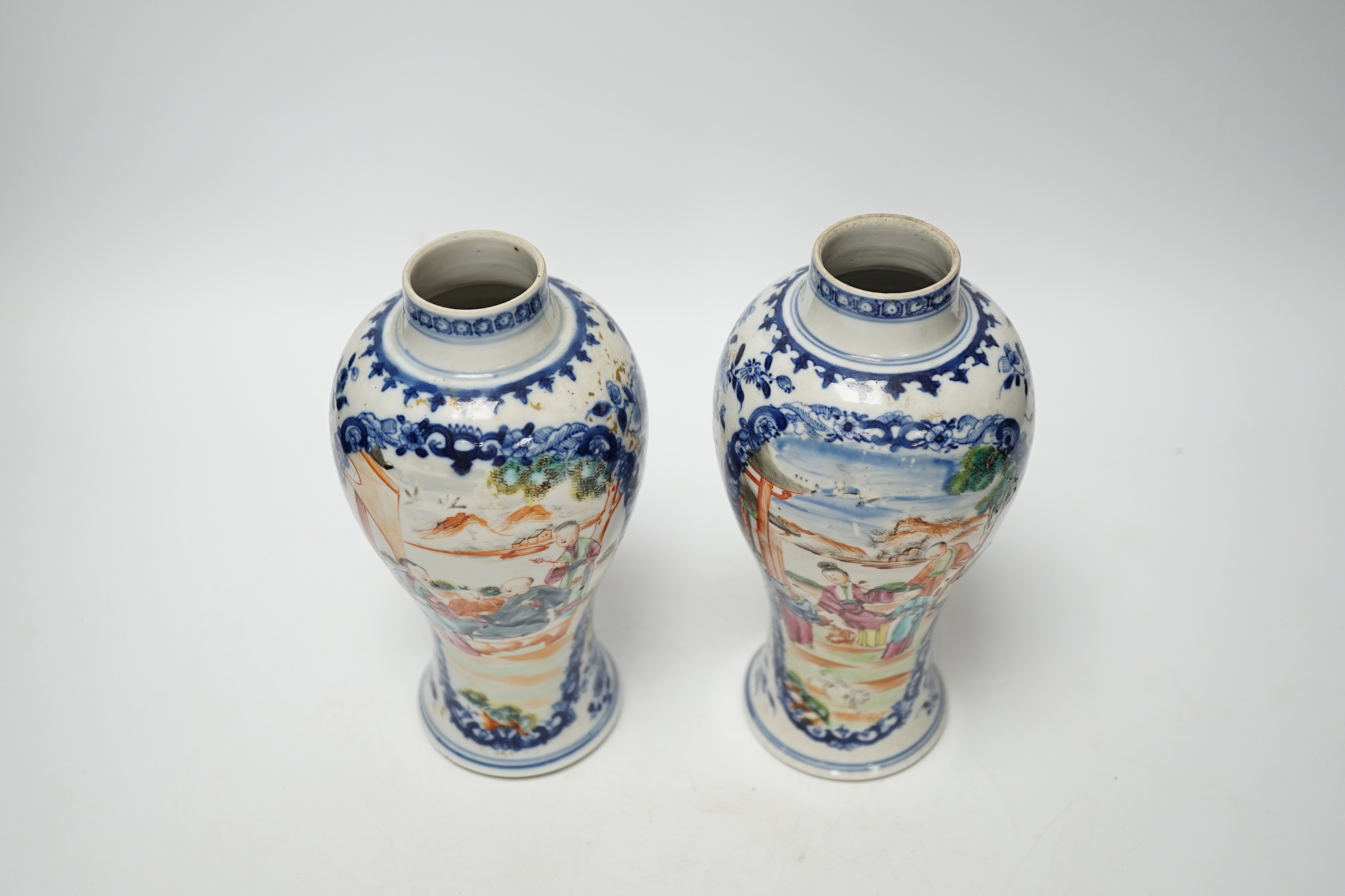 A pair of late 18th century Chinese famille rose ‘mandarin’ vases, 19cm high